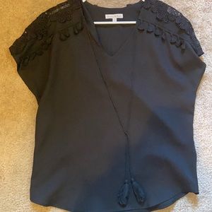 Black top with pretty tassel and lace detail